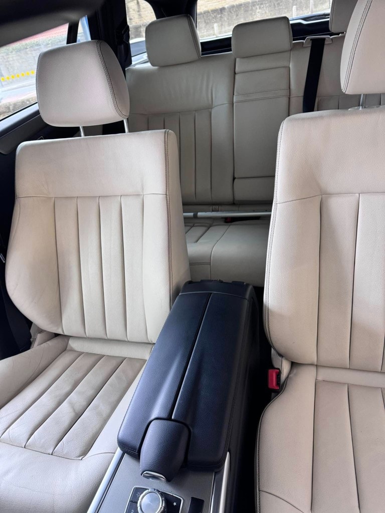 Cream leather interior — deep cleaned and conditioned front and rear seats