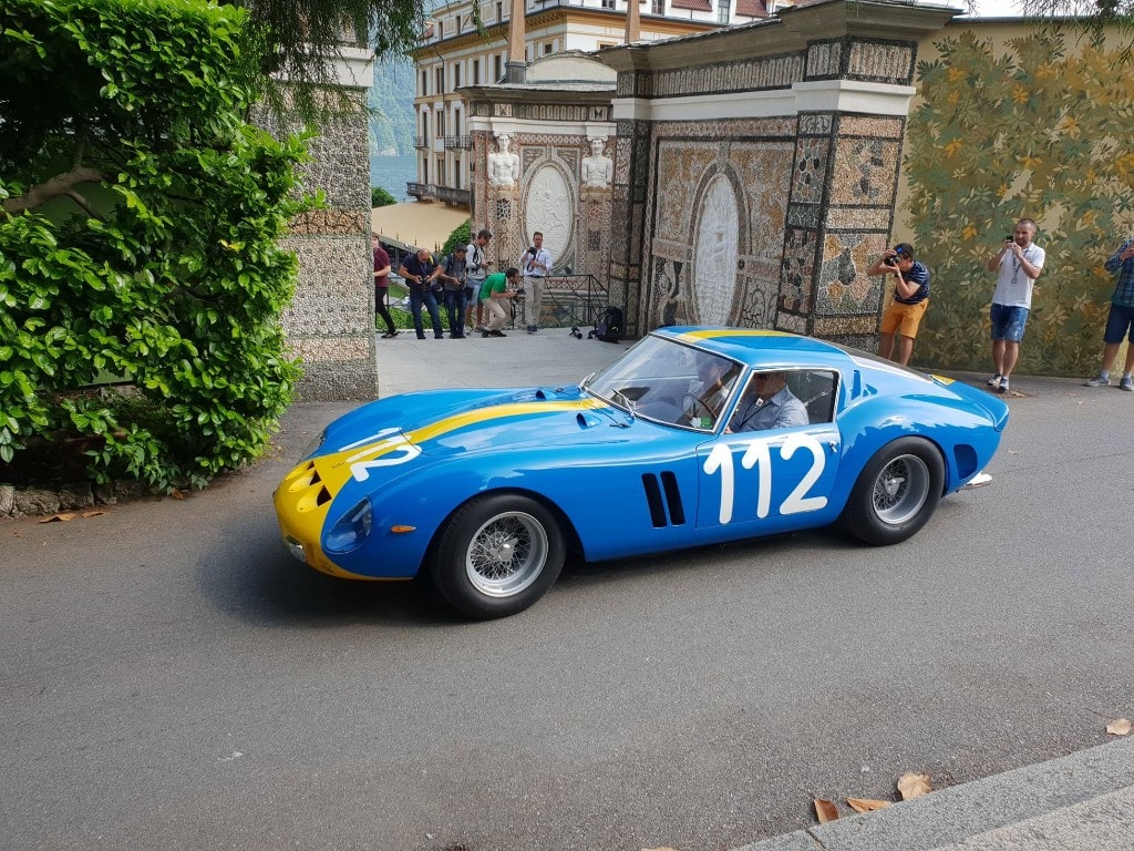 Classic Ferrari 250 GTO in racing livery at a Lake Como concours event