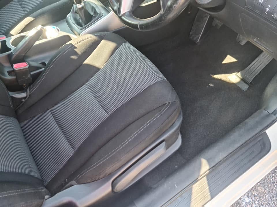 Ford Focus driver footwell after — deep vacuumed carpet, clean pedal area