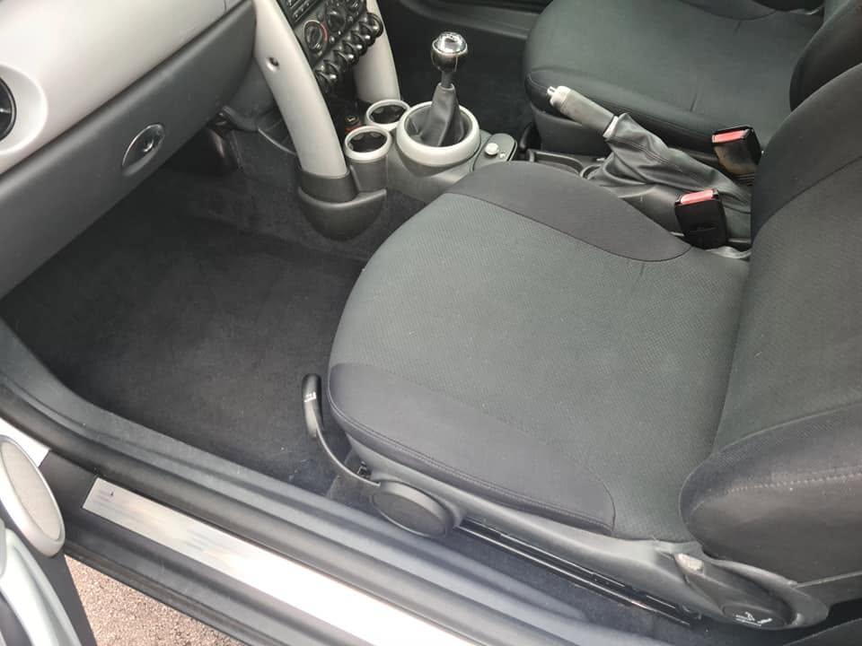 MINI interior after — fully vacuumed and cleaned, fresh carpet and seat