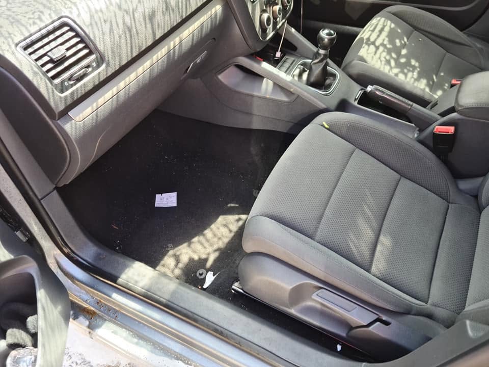 VW front footwell and seat — debris on carpet, dirty door sill before deep clean